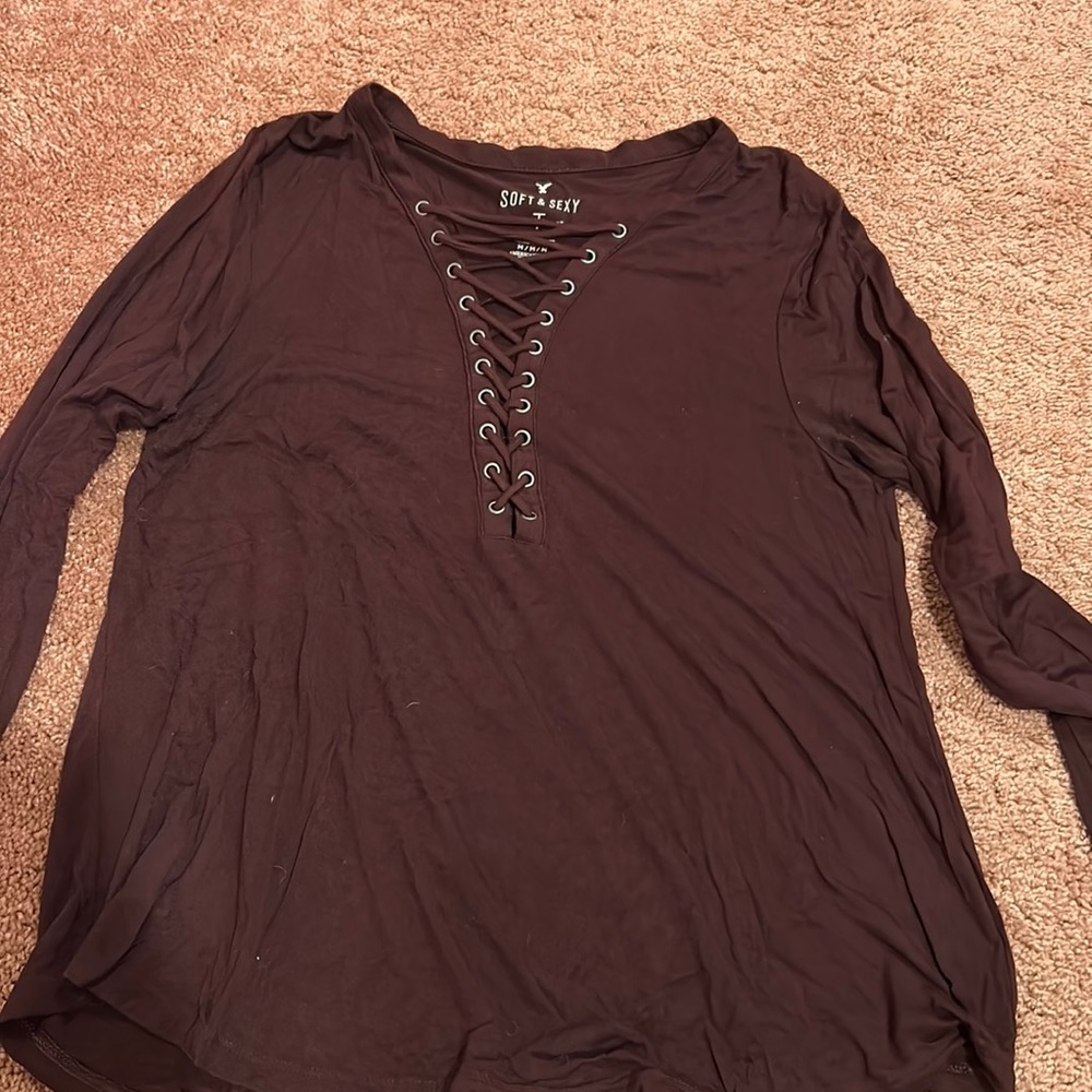MAROON (not really purple) long sleeved shirt has criss cross in front